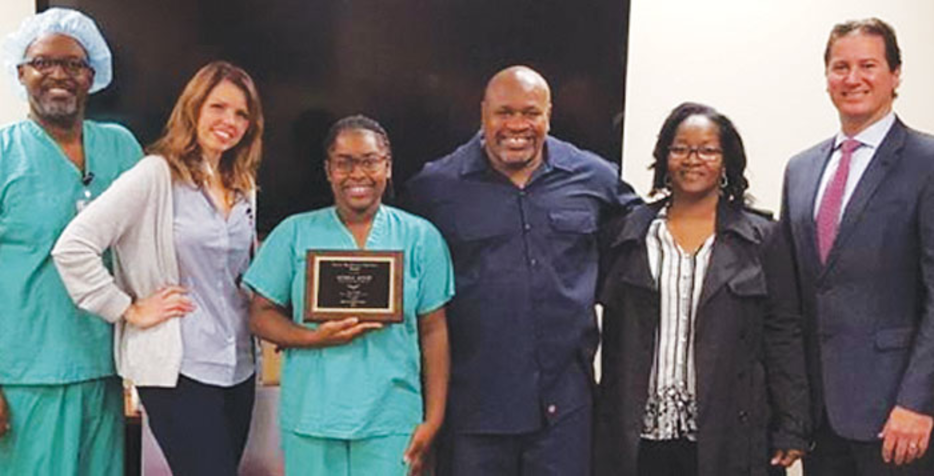 2017 SEVY Award: (from left): SPD Manager Yves Theodule, Surgical Services Executive Director Katie Sikora, Award Winner Mykeal Hood & her proud family, Chief Operating Officer Matt Primack.