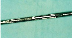 Cutaway of a laparoscopic instrument showing bioburden trapped inside of the square corners Cutaway of a laparoscopic instrument showing bioburden trapped inside of the square corners