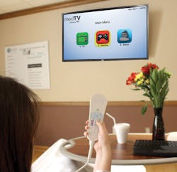 A patient cues up video games on PDi&rsquo;s medTV.