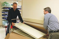 Don Ladd and David Dixon building shelves for a new storeroom at UMMC West Don Ladd and David Dixon building shelves for a new storeroom at UMMC West