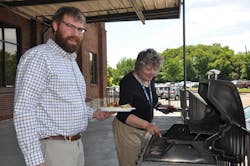 Matt Smith and Celia Tudor during Summer Grilling Wednesday on the dock at Supply Chain&rsquo;s Corporate location