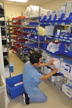 Yeshi Samdup restocking the supplies in the Fairview Southdale Emergency Department storeroom Yeshi Samdup restocking the supplies in the Fairview Southdale Emergency Department storeroom