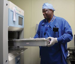 Marvin Kendrick, Instrument Tech Lead, loads a set into the Sterrad sterilizer. Marvin Kendrick, Instrument Tech Lead, loads a set into the Sterrad sterilizer.