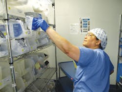 Lisa Hamilton picking an item for a case Lisa Hamilton picking an item for a case