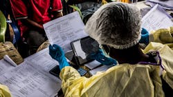 Health workers fill paper form before vaccinating people who have been in touched with other people who got Ebola infected. Photo: World Bank / Vincent Tremeau Health workers fill paper form before vaccinating people who have been in touched with other people who got Ebola infected. Photo: World Bank / Vincent Tremeau