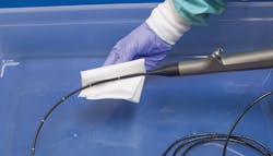 Using a damp cloth to wipe the shaft of the endoscope down during the decontamination process removes any exterior gross debris.