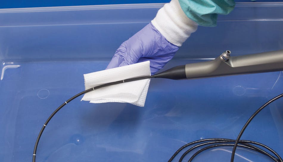 Using a damp cloth to wipe the shaft of the endoscope down during the decontamination process removes any exterior gross debris.