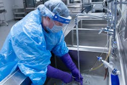 Tech II Jo Ann Matthews cleans instrumentation. Tech II Jo Ann Matthews cleans instrumentation.