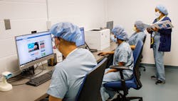 New hire orientation takes place in the training lab with Raymond Querubin, Kidest Shibeshi and Bernadette Masaniai with trainer Deborah Ogunbiyi (standing far right). New hire orientation takes place in the training lab with Raymond Querubin, Kidest Shibeshi and Bernadette Masaniai with trainer Deborah Ogunbiyi (standing far right).