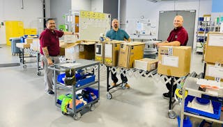 Three demonstrate One Piece Flow Receiving (from left to right): Jon Borgo, Distribution Supervisor; Francisco Perez, Director, Supply Chain Operations; and Tyler Mitchell, Supervisor, Distribution