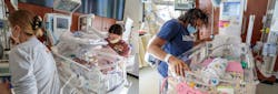 Alison McIntyre, RN and a nursing teammate ensure all infants have been safely moved into the new space, while new mother Imani Rue spends quality time with her daughter, DeKota.
