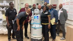 Operations team getting to know the new Moxi delivery robot by Diligent Robotics