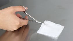 Testing the sharpness of scissors with gauze. Testing the sharpness of scissors with gauze.