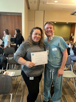 Cherie Dominguez and Dr. W. Zeh Wellington, OR Director, presenting her Improvement Scholar graduation certificate. Cherie Dominguez and Dr. W. Zeh Wellington, OR Director, presenting her Improvement Scholar graduation certificate.