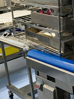 This picture shows equipment in need of repair. The instrument washer rack transport cart is not level with the loading dock of the washer, creating a safety issue.