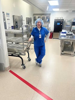 Ann & Robert H. Lurie Children’s Hospital Shift SPD Supervisor Cherie Dominguez standing behind the red line. Ann & Robert H. Lurie Children’s Hospital Shift SPD Supervisor Cherie Dominguez standing behind the red line.