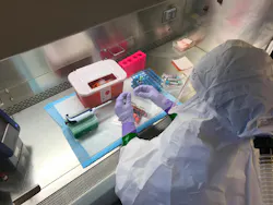 Laboratory NETEC at UNMC: A laboratorian practices safely handling high-consequence infectious disease specimens in a biosafety cabinet.