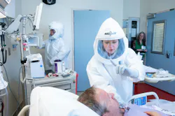 A NETEC evaluator observes a simulated patient care scenario in Emory University’s Serious Communicable Diseases Unit during the 2025 Tranquil Passport exercise.